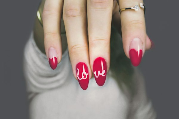Classic red manicure with nail art accents